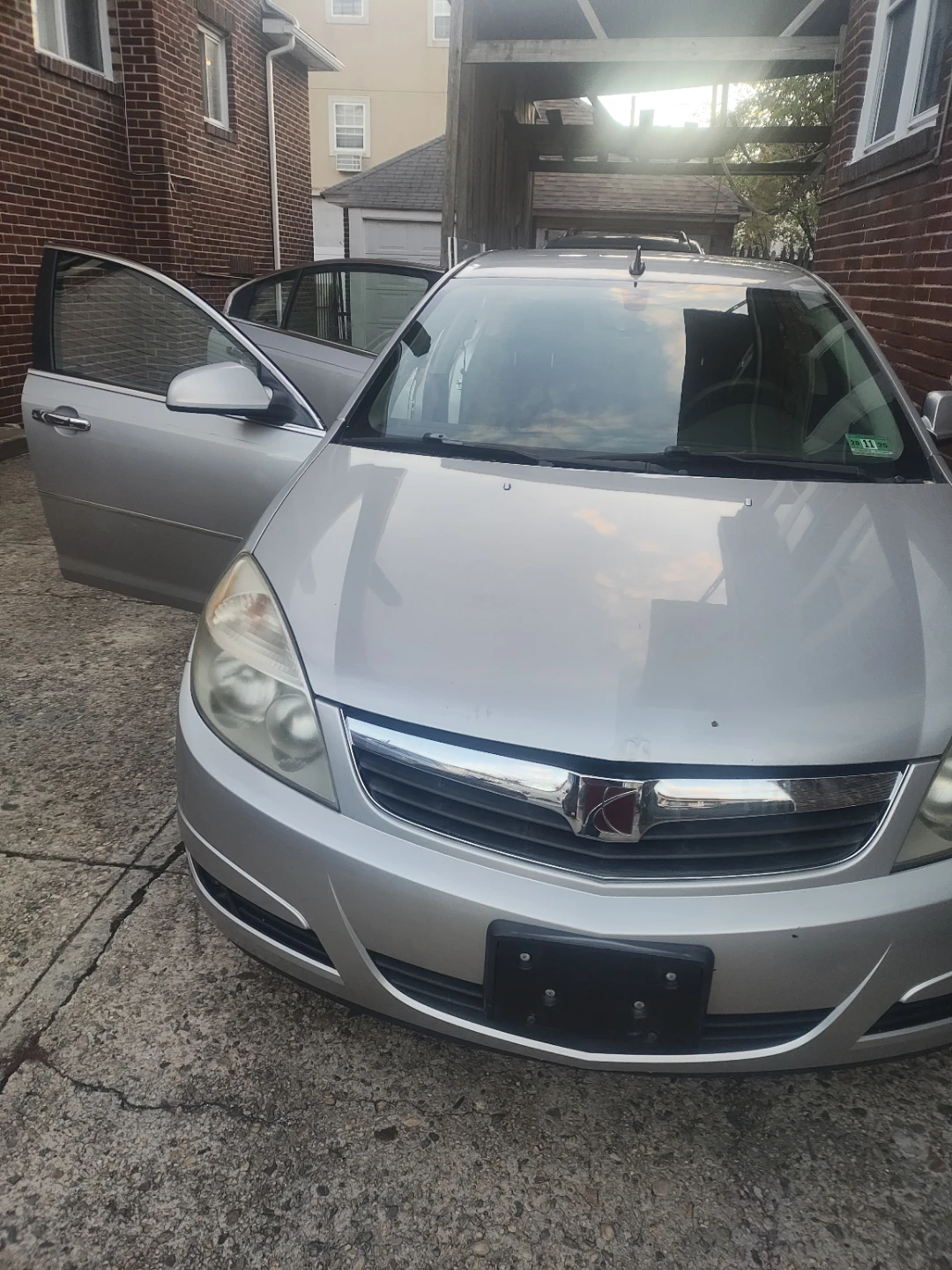 Silver Saturn Aura Sedan