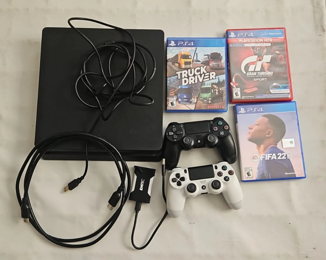 PlayStation 4 with Games and Controllers