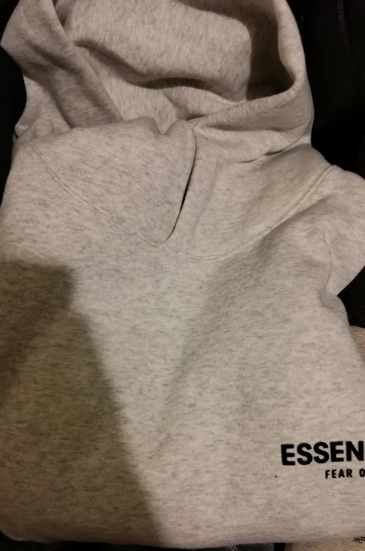Essentials light oat/black hoodie price negotiable