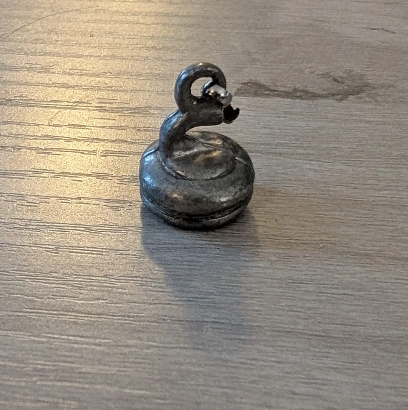 Curling Rock Zipper Charm