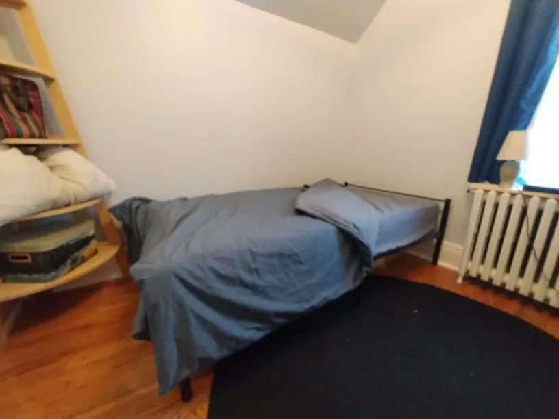 Black Metal Bed Frame with mattress and sheets