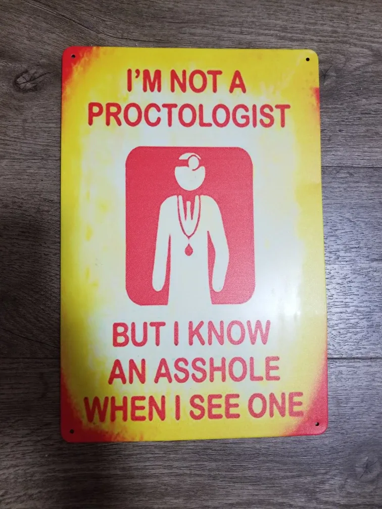 Humorous Metal Sign - I'm Not A Proctologist