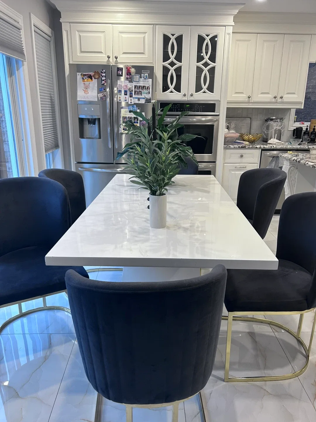 White dinner table with chairs