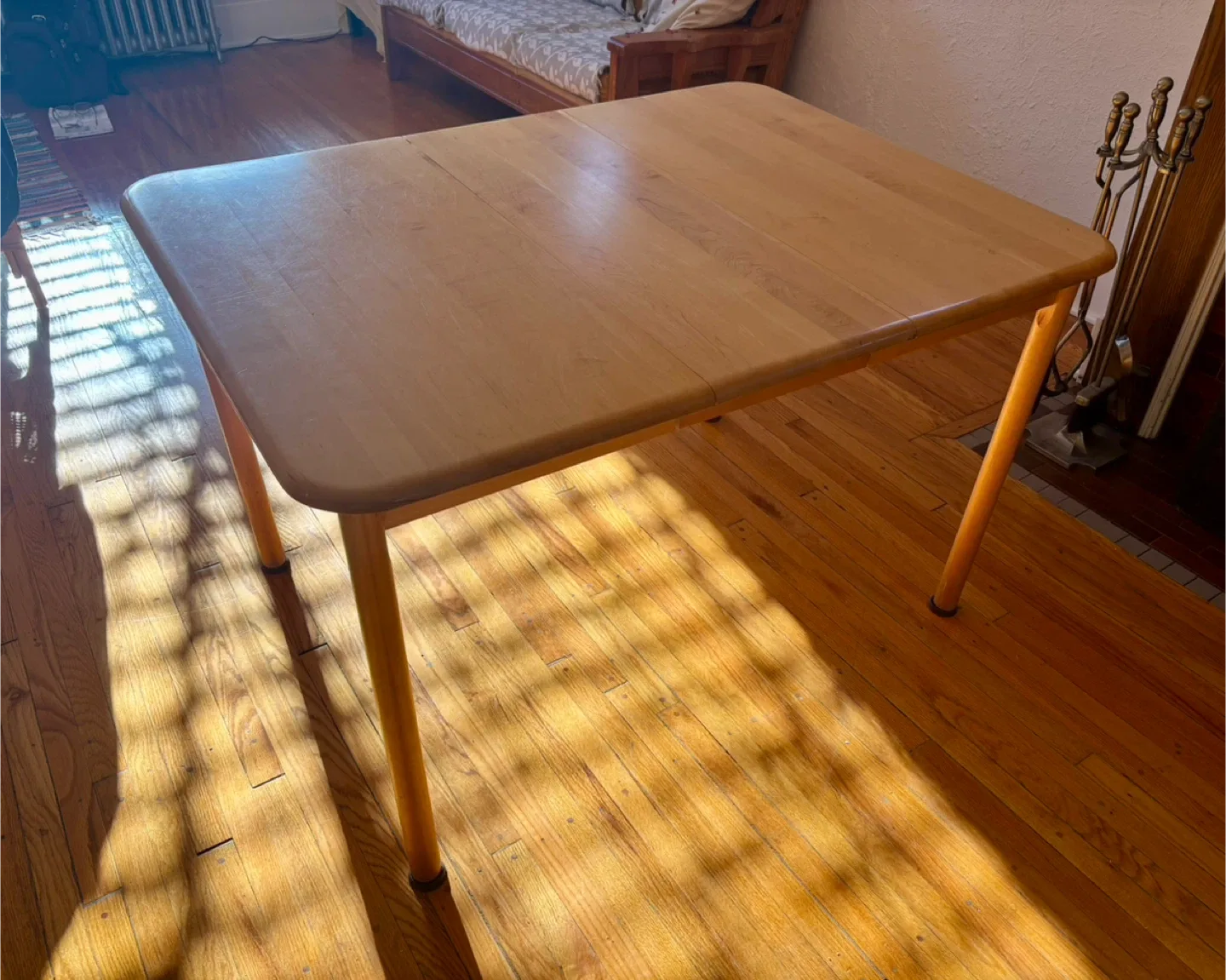 Wood table with removable leaf
