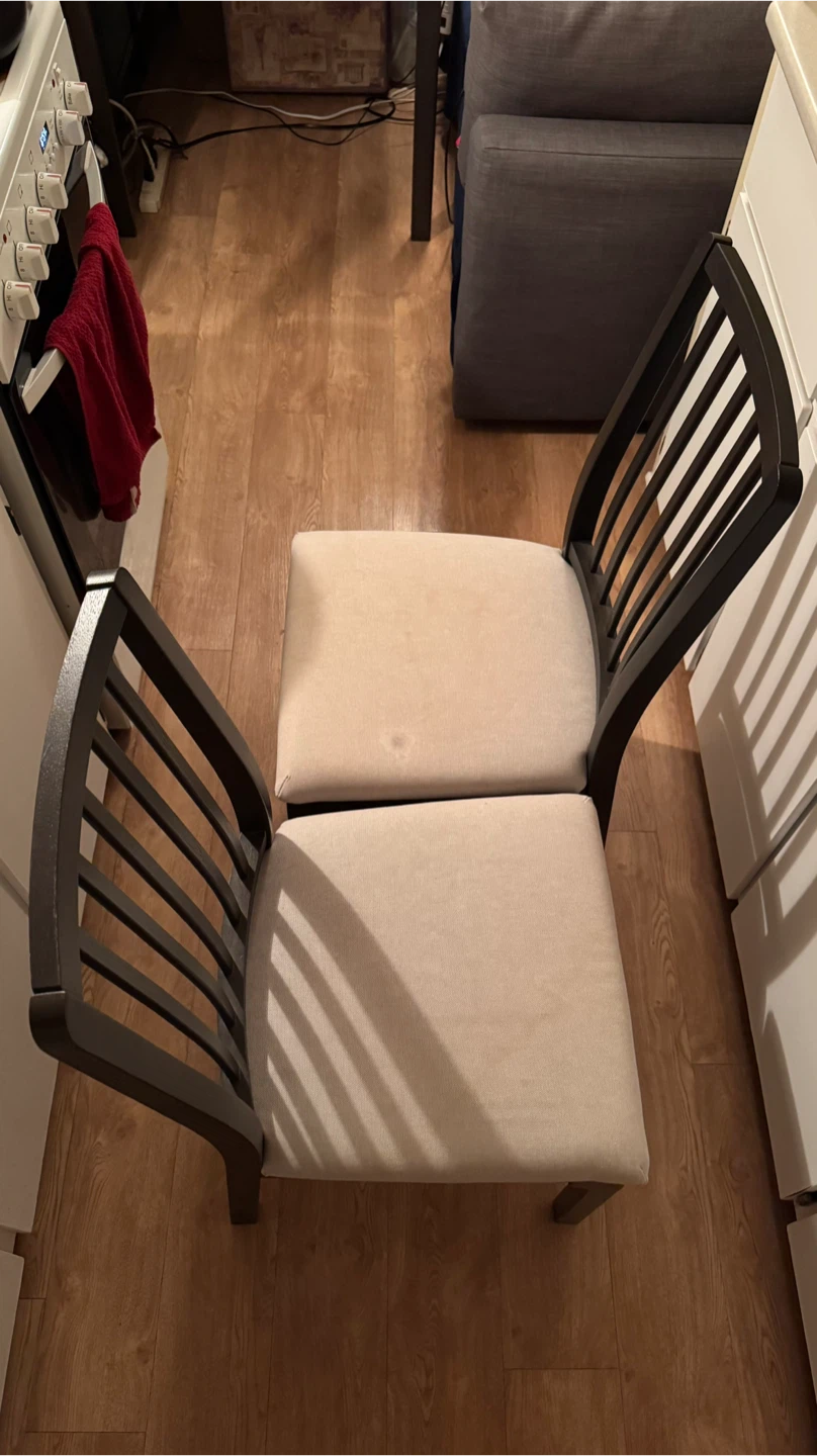 Pair of IKEA dining chairs (dark wood & beige seats)