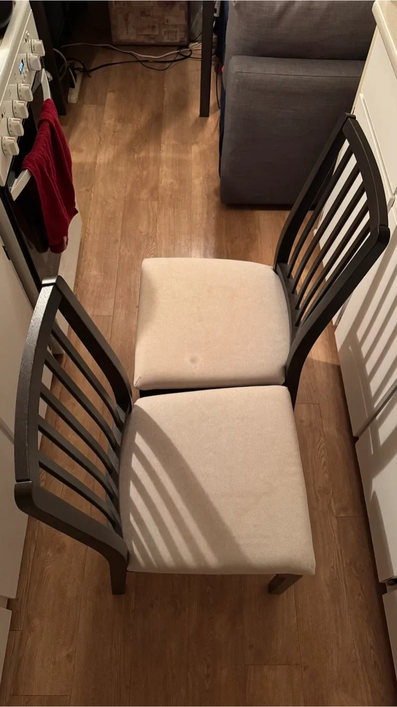 Pair of IKEA dining chairs (dark wood & beige seats)