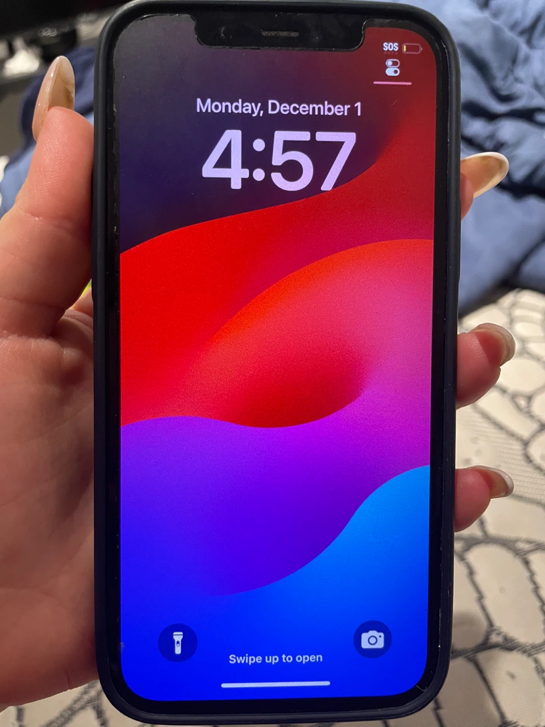 Black iphone 12 with case and lense protector