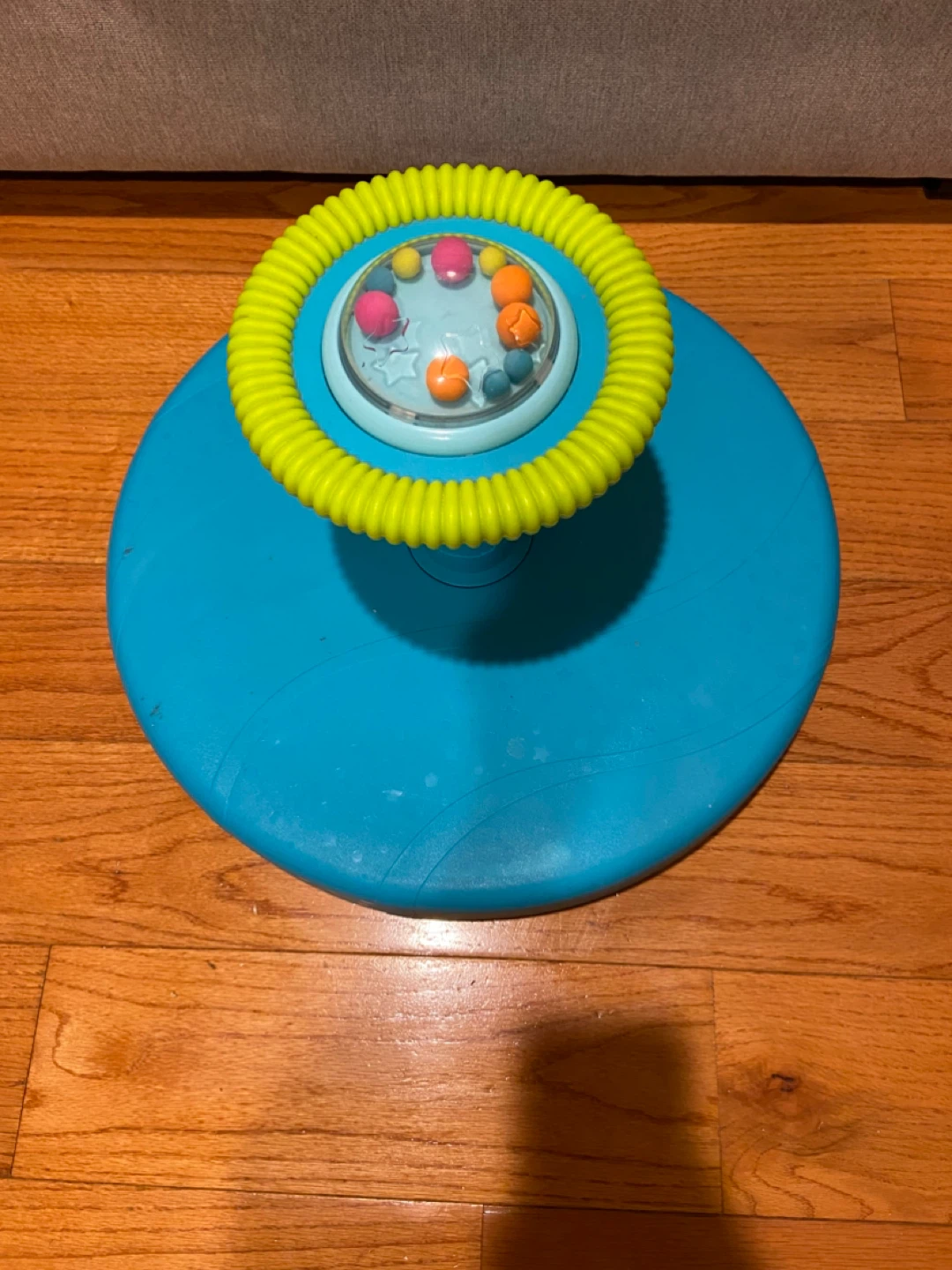 B. toys Twirly Time Spinning Activity Toy