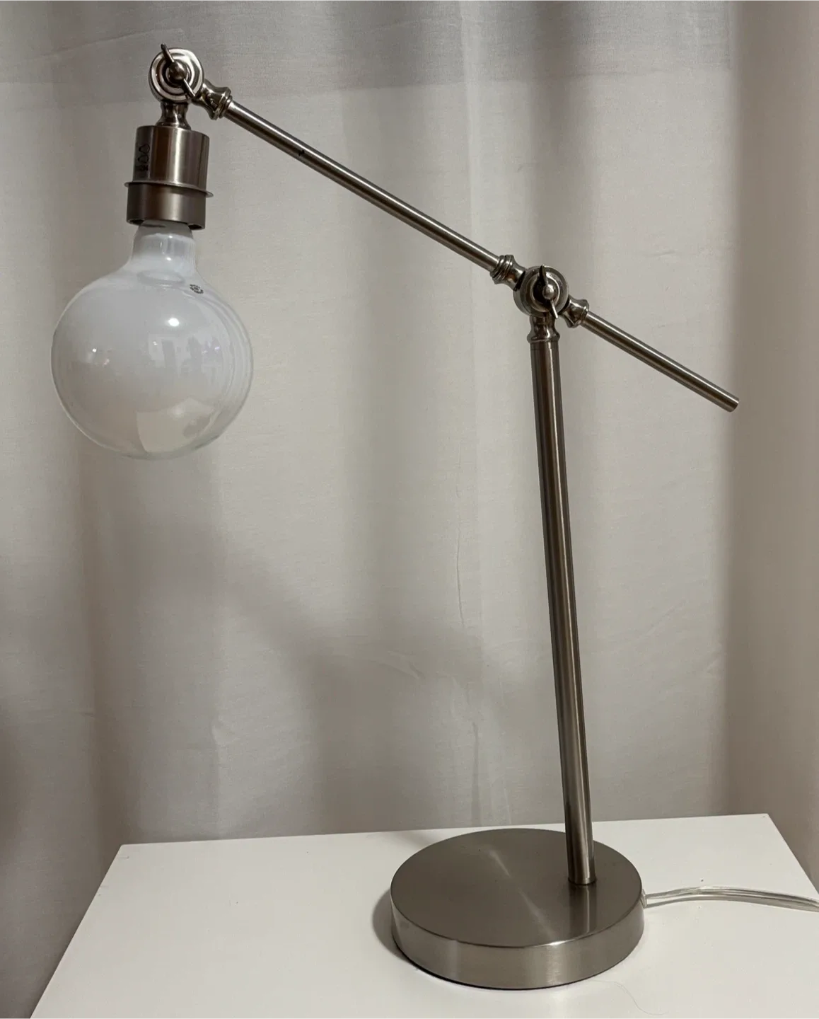 Stylish Silver Desk Lamp and IKEA Bedside Table image indicator(2)