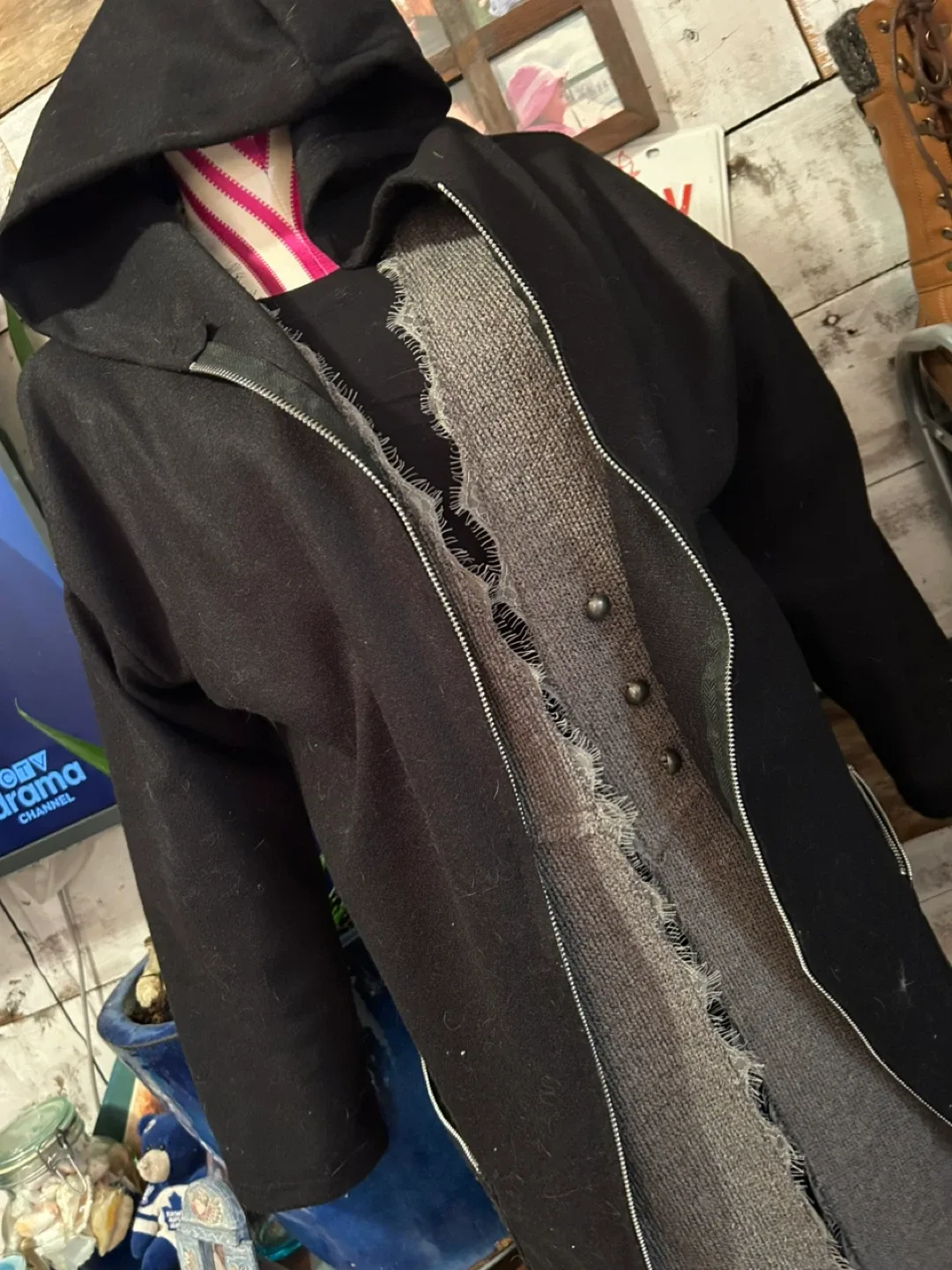 Black hooded coat with zipper, size unknown