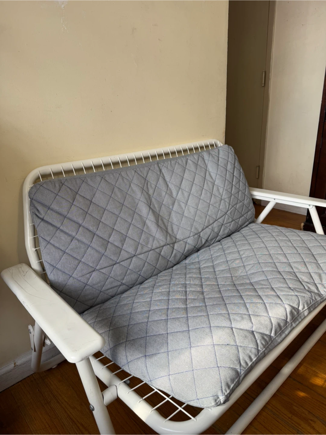White Metal Frame Loveseat with Gray Quilted Cushion