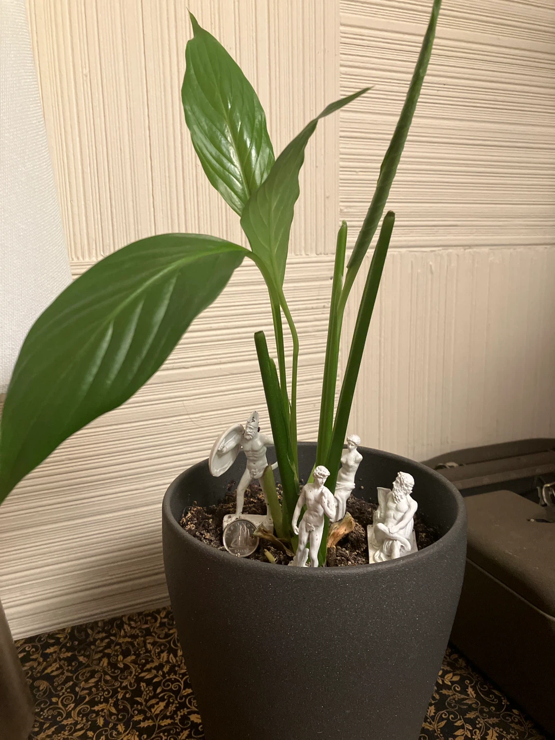 Cute miniature Greek Statue models to sit in a potted plant!