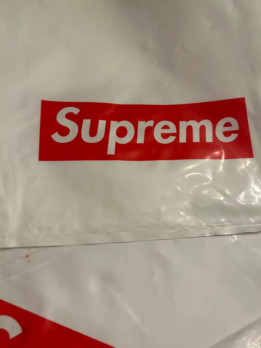 Supreme branded white plastic shopping bags image indicator(2)