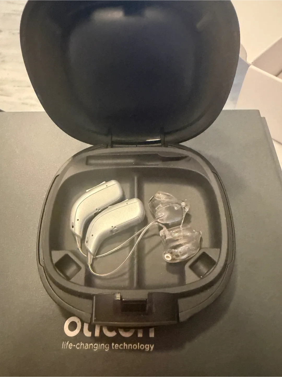 Oticon rechargeable hearing aid. EUC