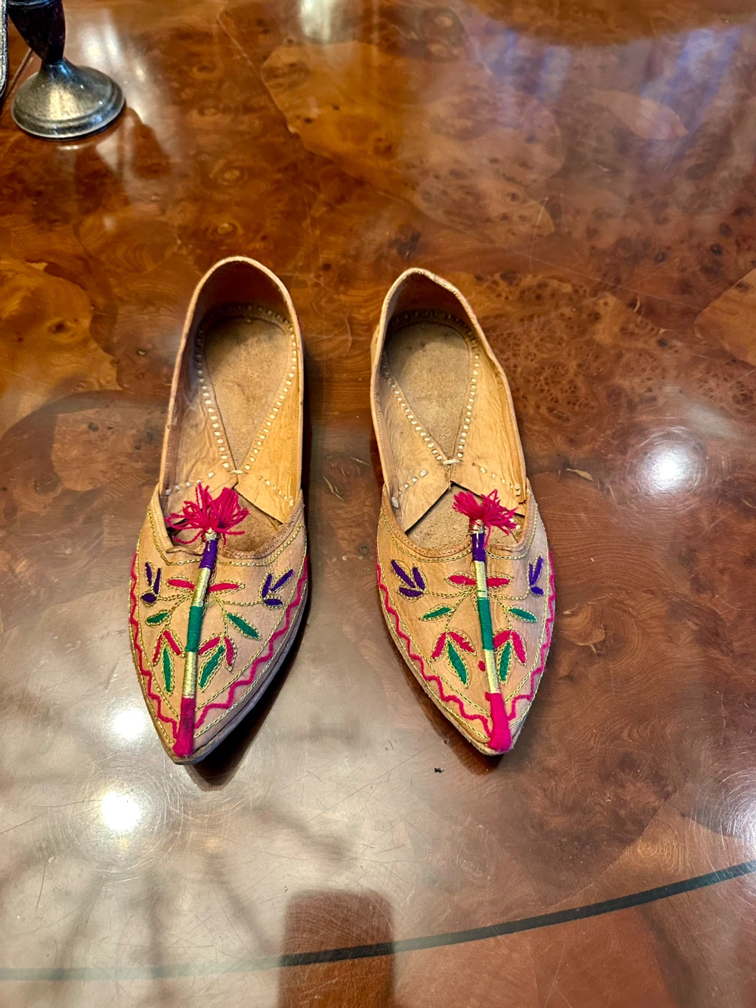 Tan and pink embroidered leather flats with tassels