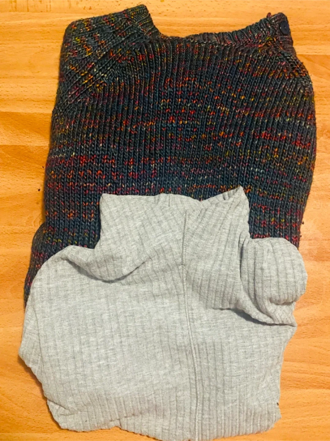 Two sweaters, gray and multicoloured