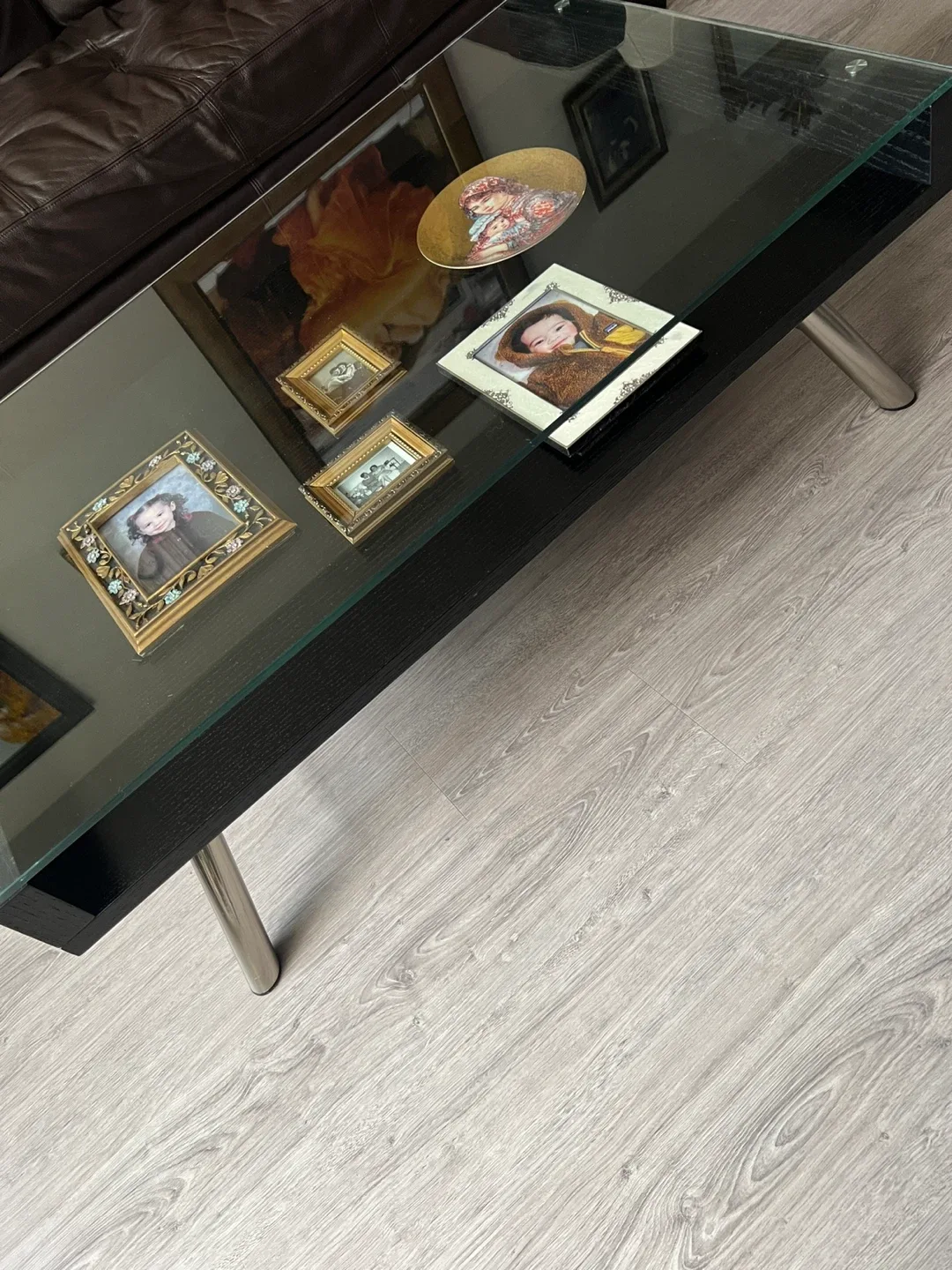 Sleek Black Coffee Table with Glass Display Shelf image indicator(6)