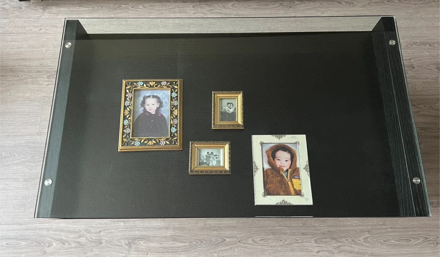 Sleek Black Coffee Table with Glass Display Shelf image indicator(7)