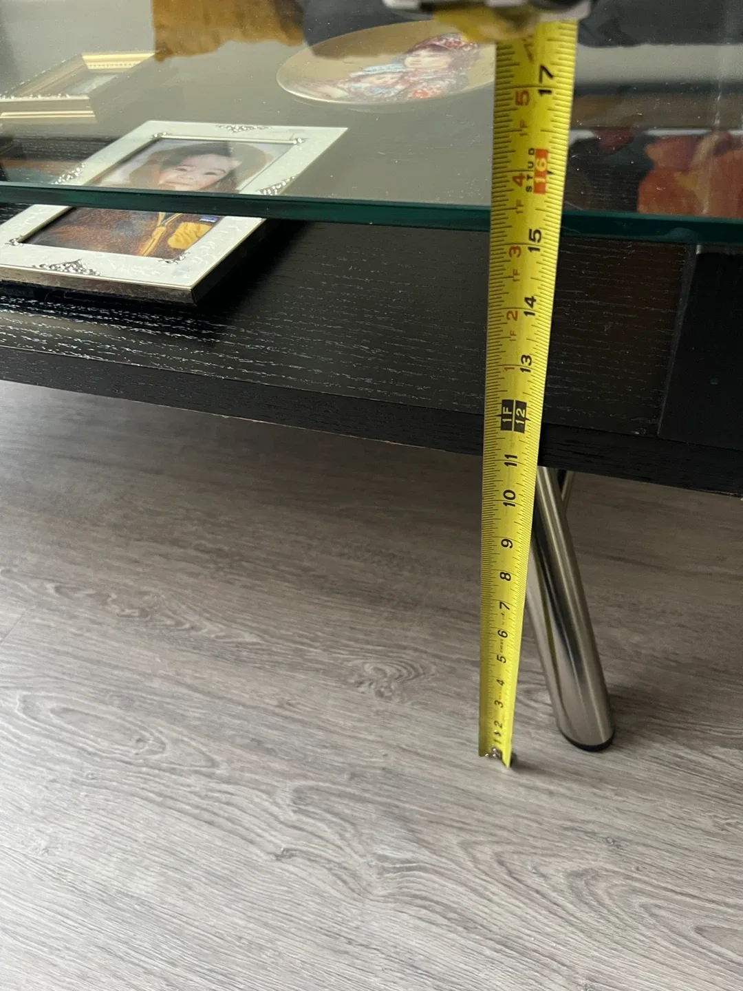 Sleek Black Coffee Table with Glass Display Shelf image indicator(10)