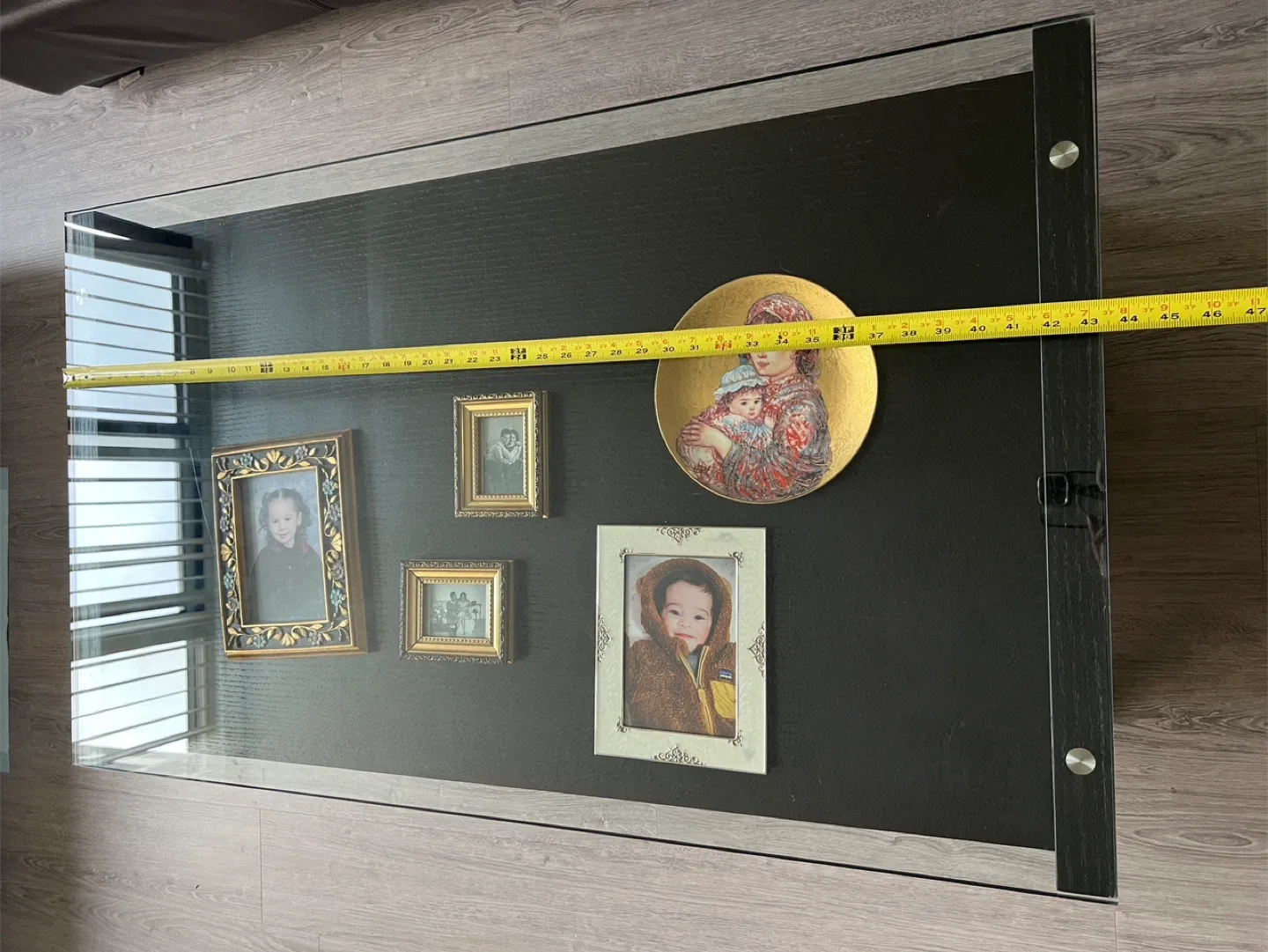 Sleek Black Coffee Table with Glass Display Shelf image indicator(8)