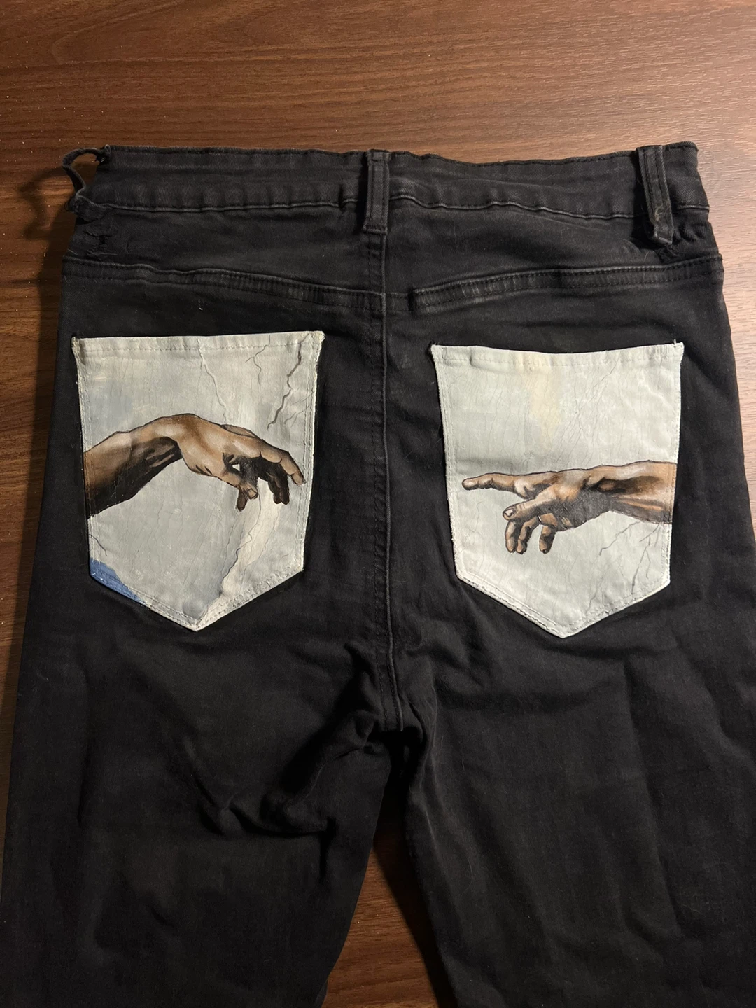 Jeans with Michaelangelo’s “The Creation of Adam”