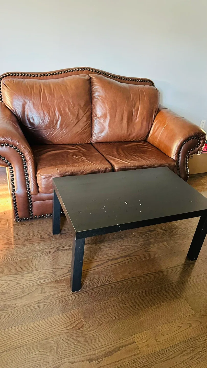Brown Leather Loveseat & Black Coffee Table