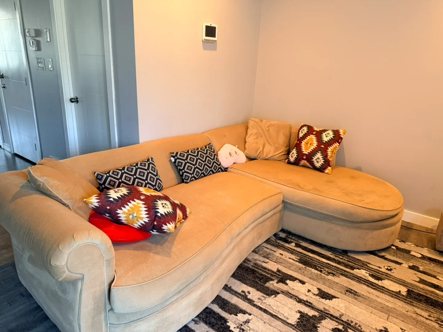 Beige Sectional Sofa with Cushions