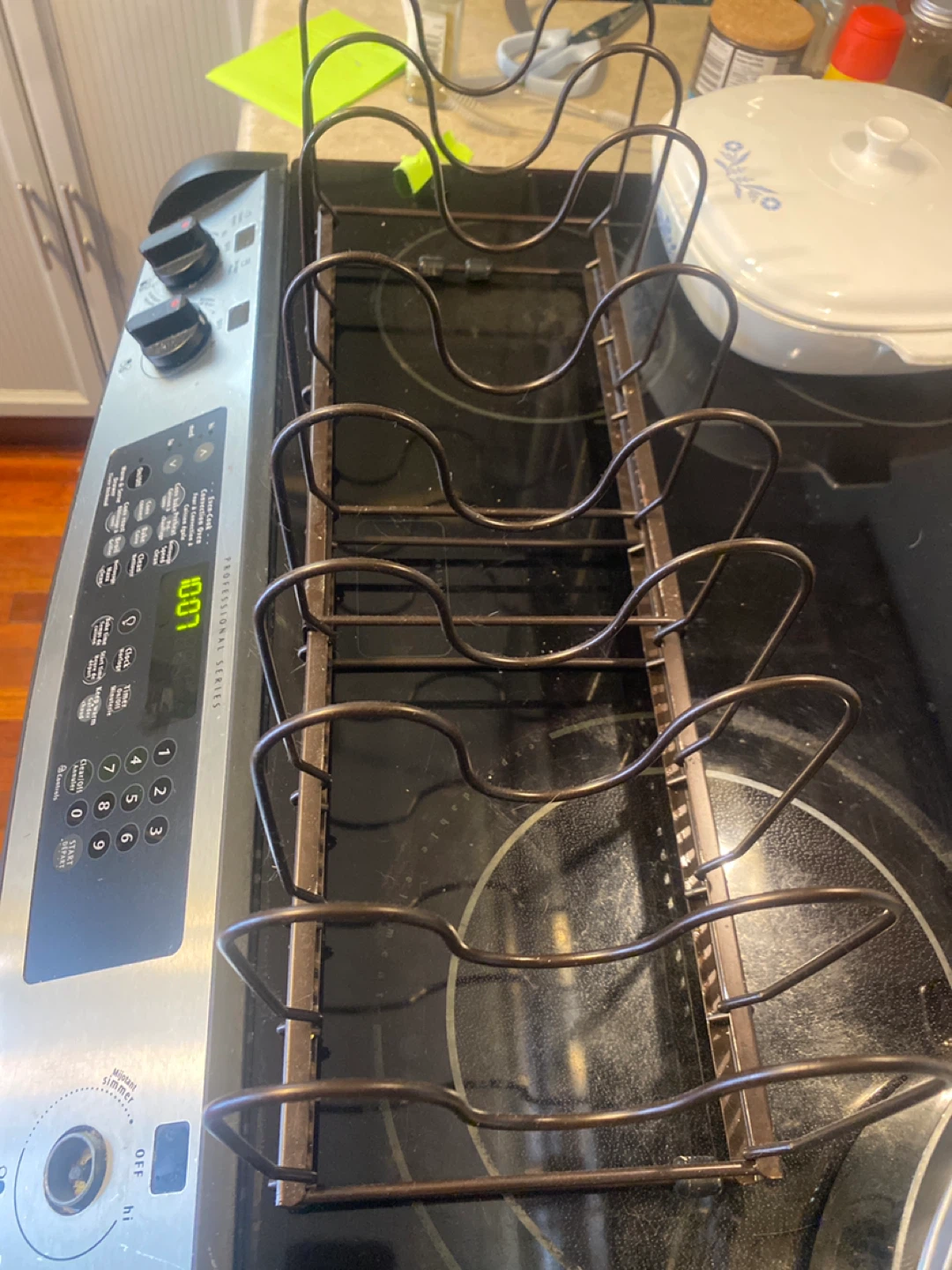 Frying pan holder/organizer for cabinet