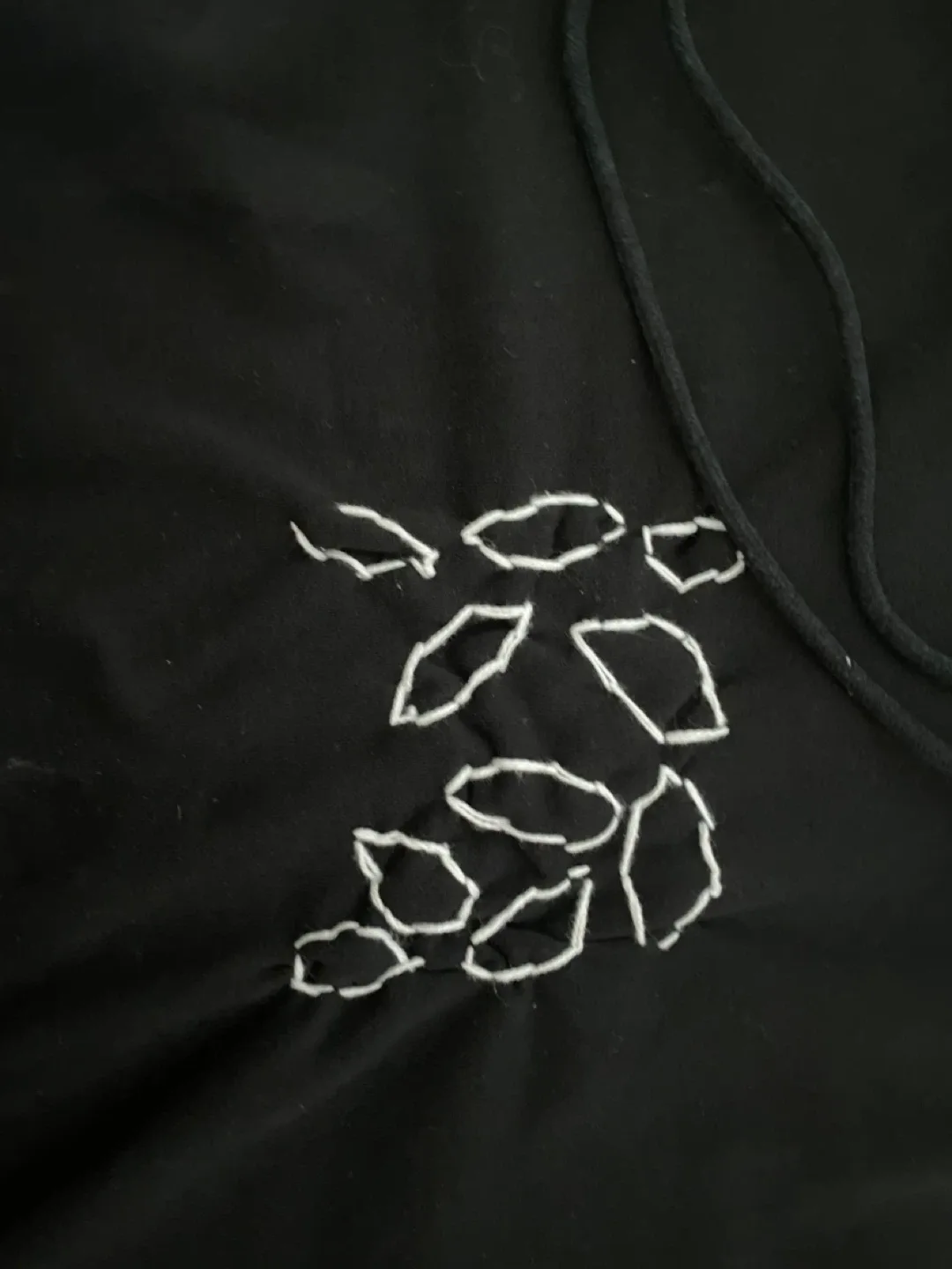 Black Hoodie with White Design image indicator(2)