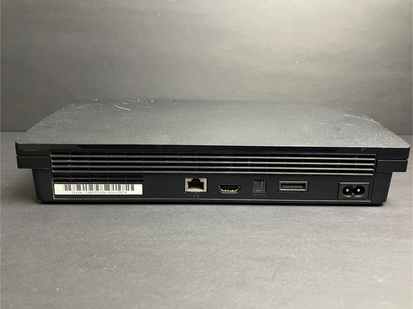 Sony PlayStation 3 (PS3) Console with 5 Games & 2 Controllers image indicator(4)