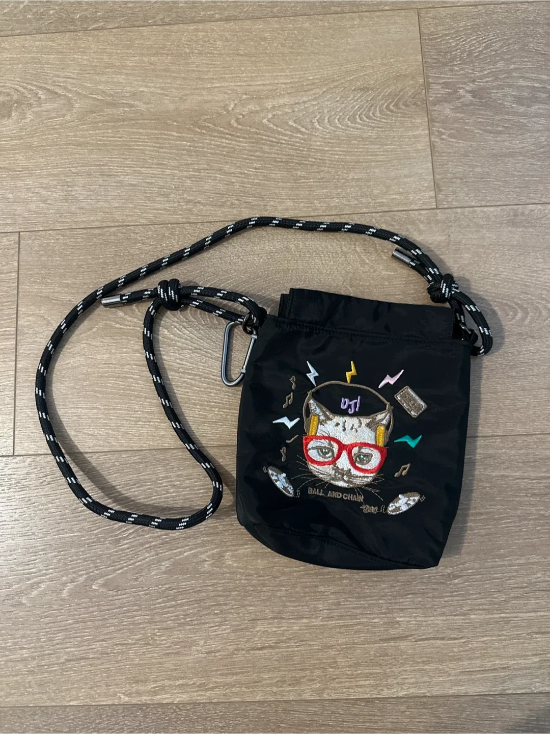 Crossbody cat stitch bag with adjustable strap