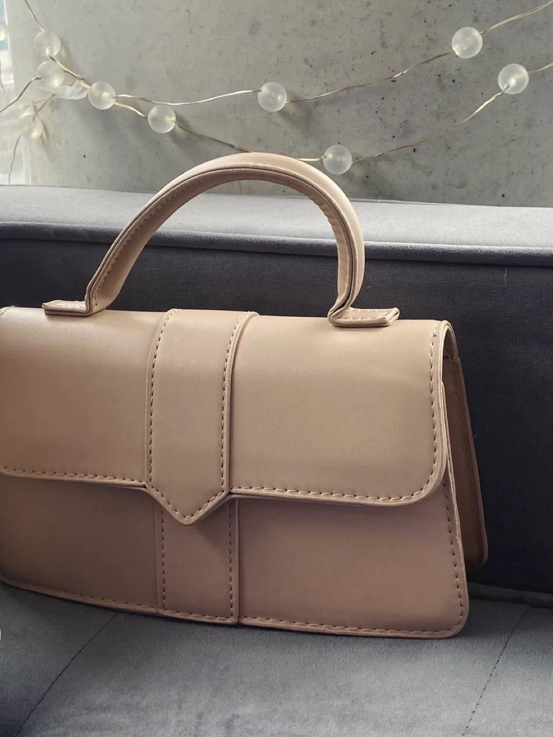 Beige minimalist top handle flap square bag image indicator(2)