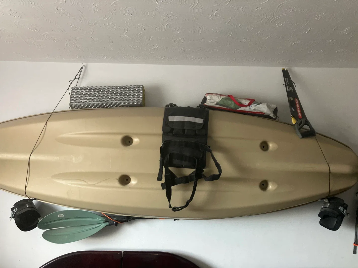 Beige Kayak with Paddle