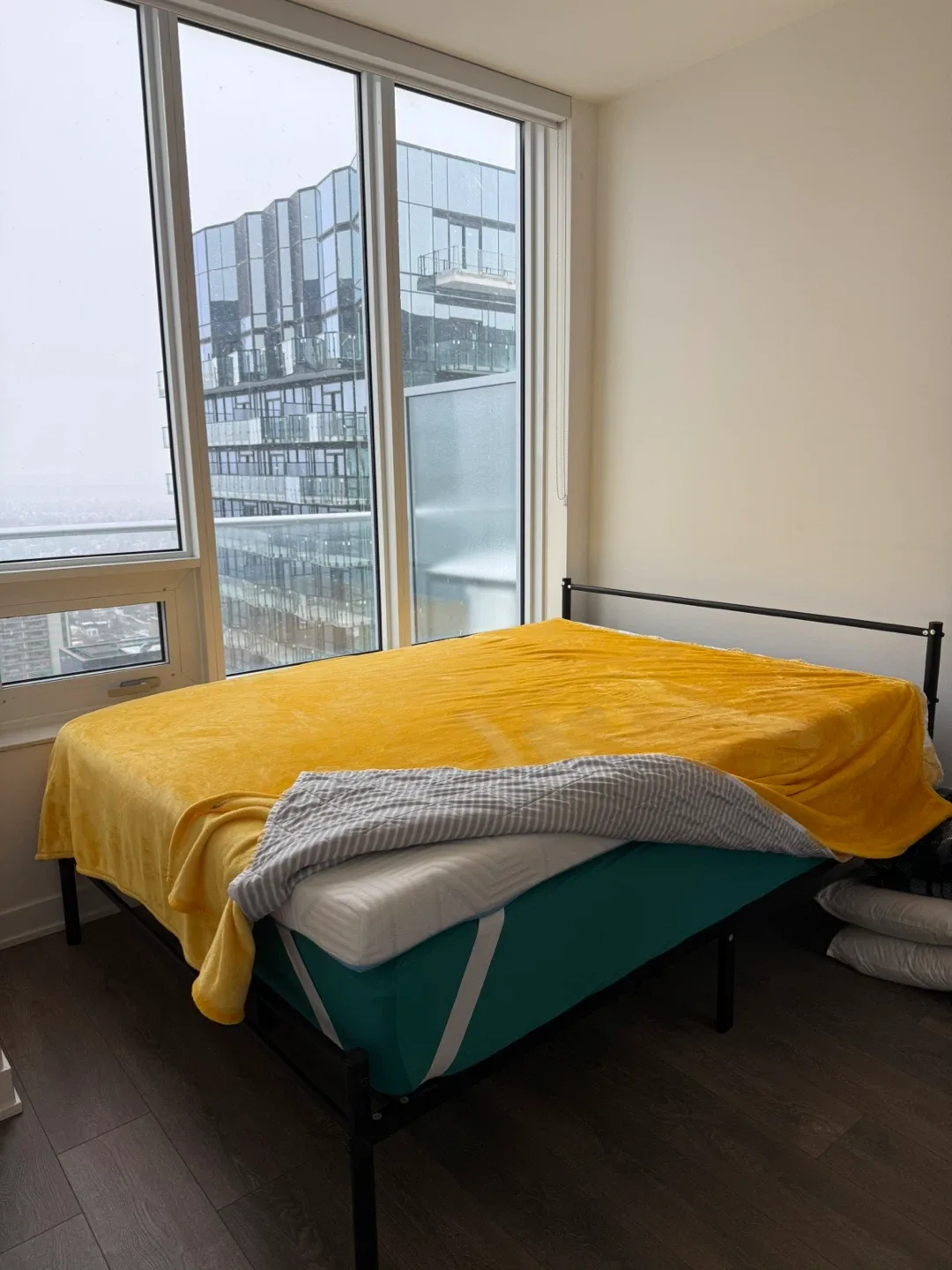 Bed frame with mattress and mattress topper