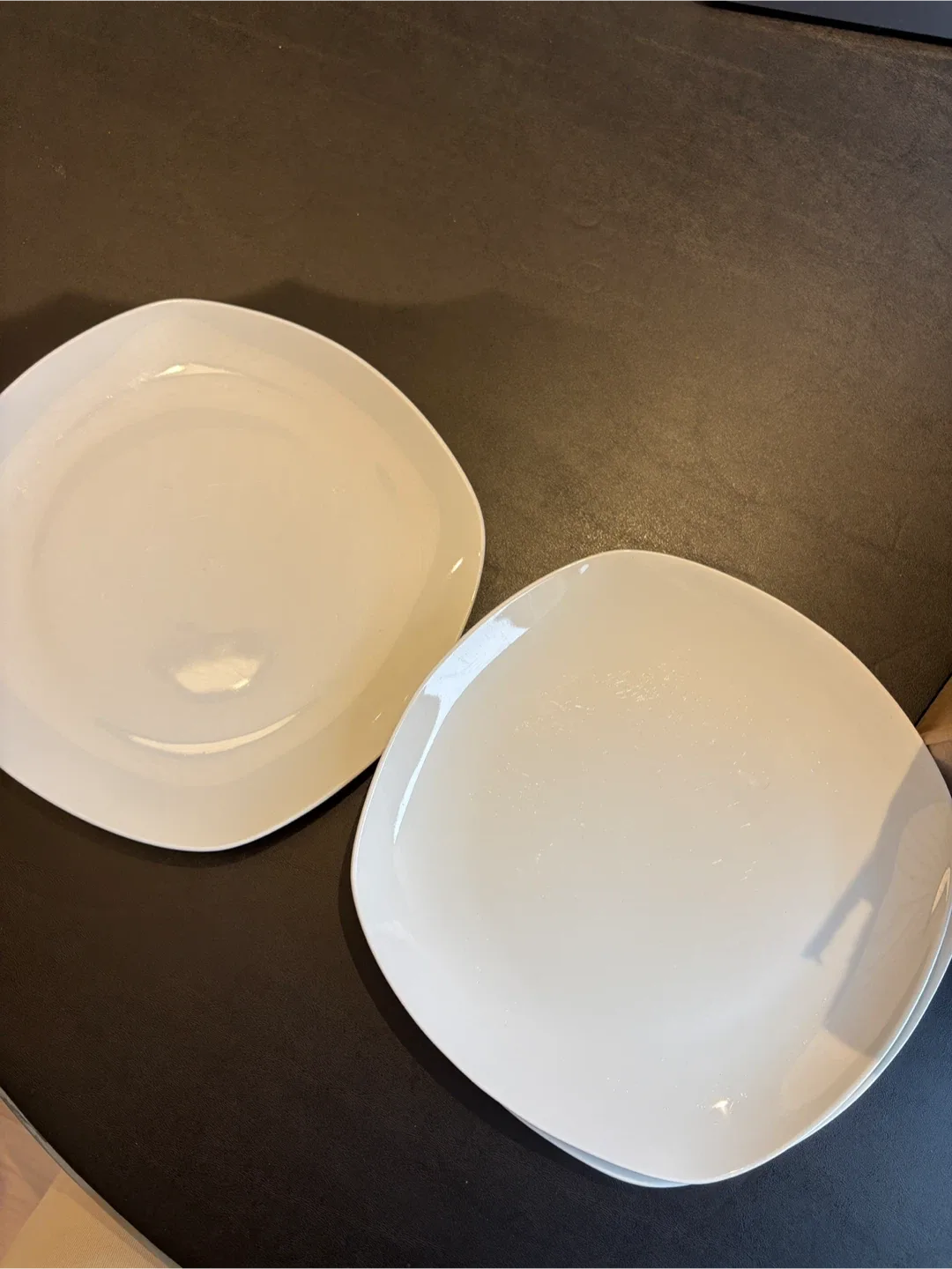 Three white square dinner plates