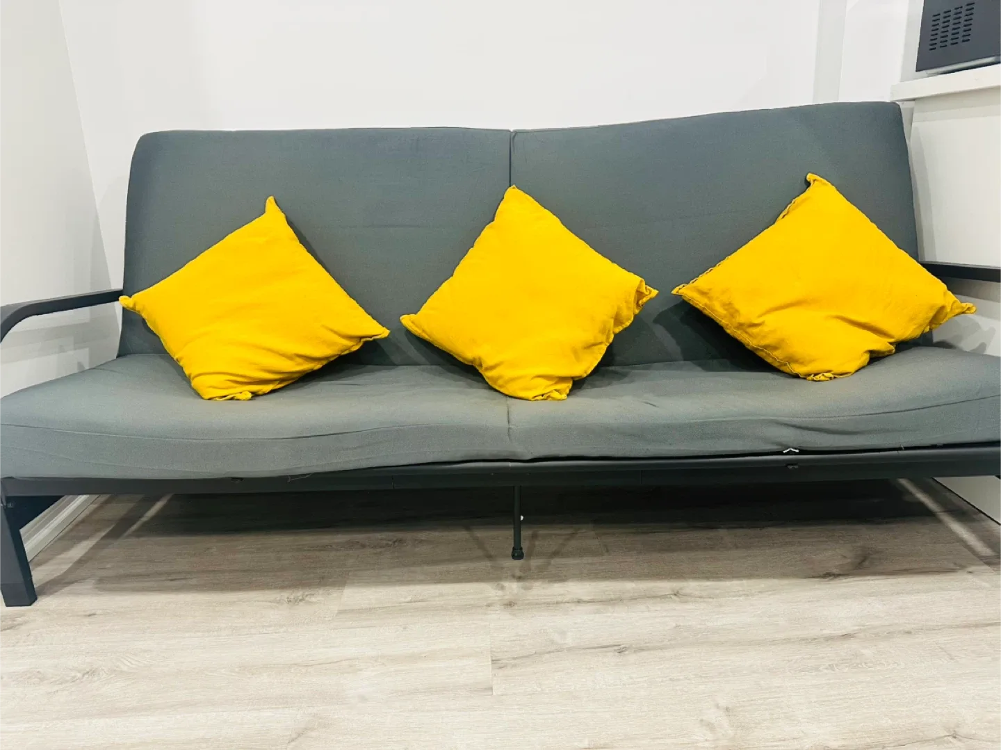 Grey Sofa cum bed with Yellow Pillows