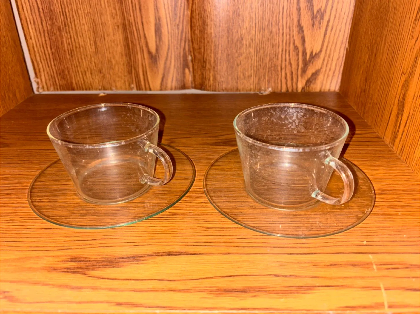 Two Clear Glass Tea Cups with Saucers