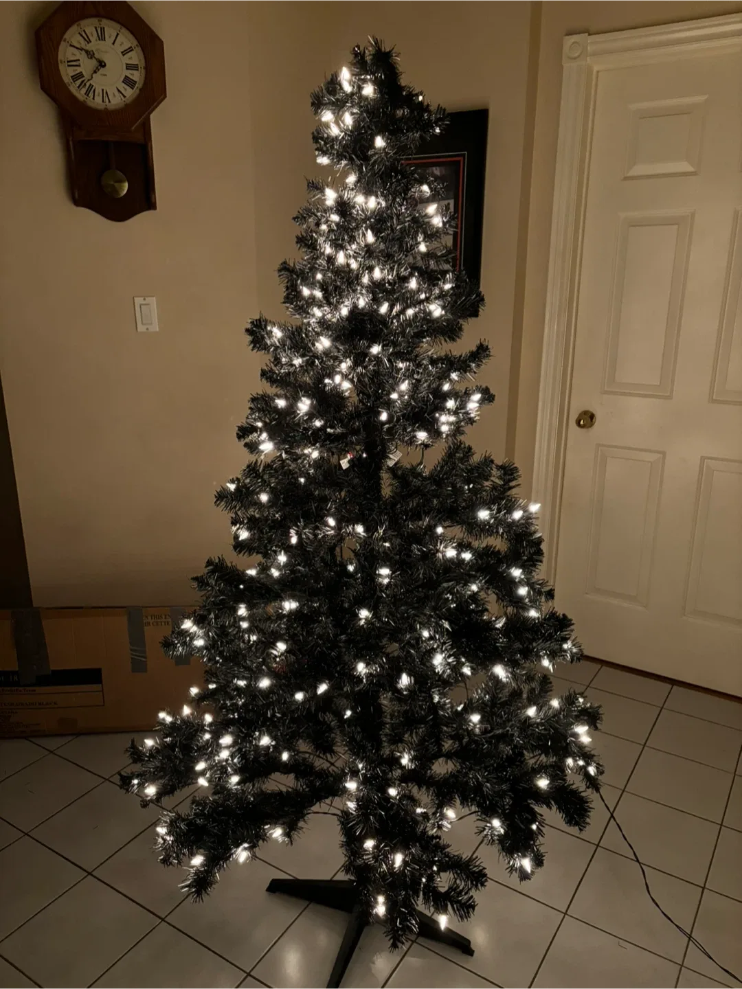 7ft black Christmas tree with white lights built in