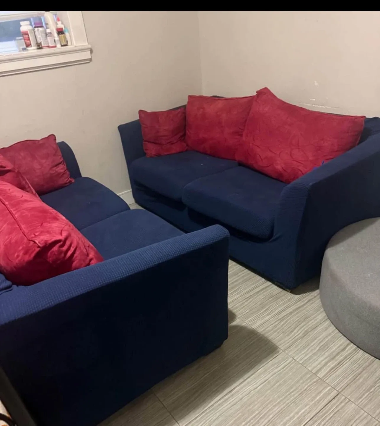 Blue Sofa Set with Red Pillows