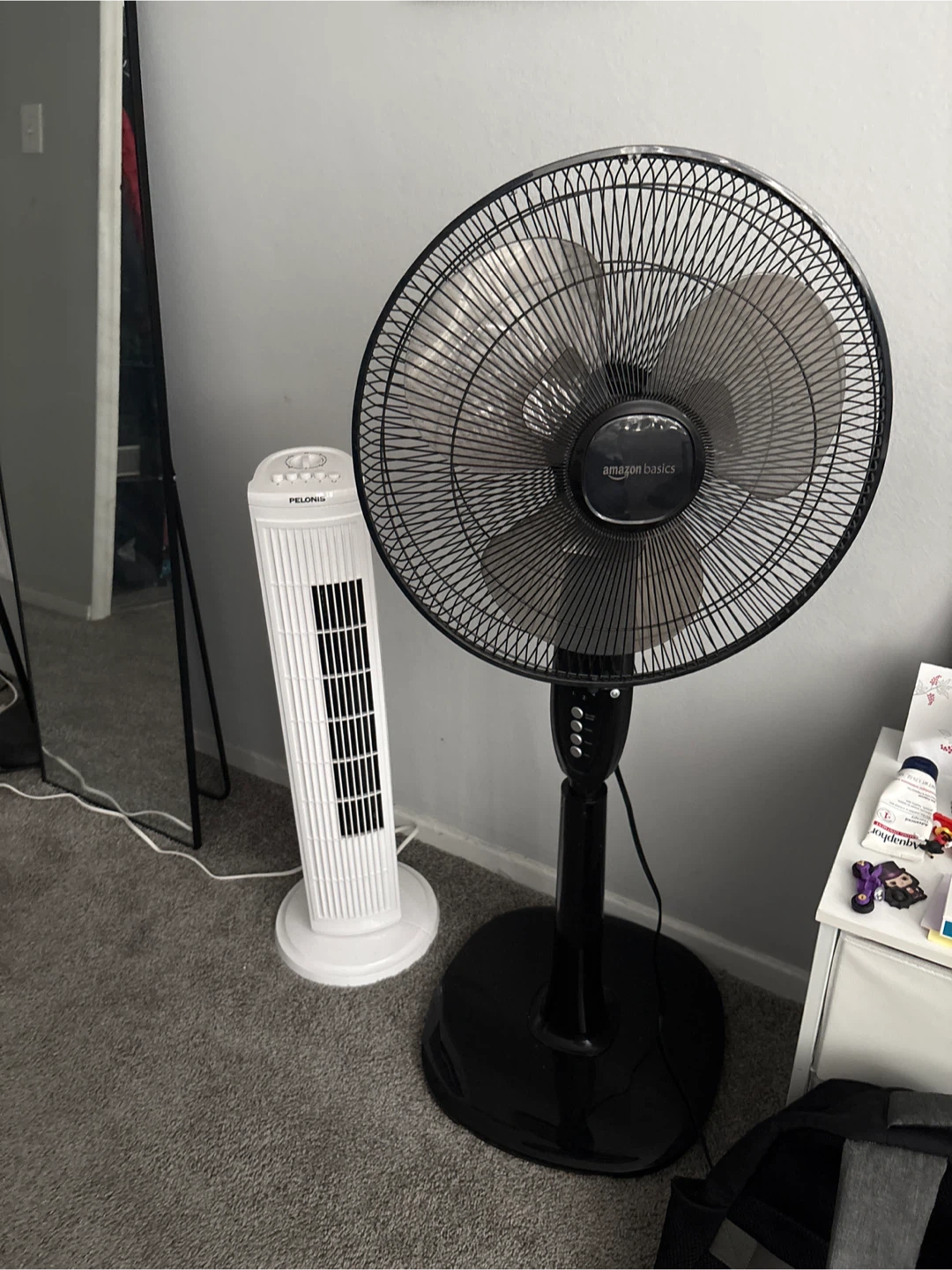 Amazon Basics Black Stand Fan & Pelonis Tower Fan