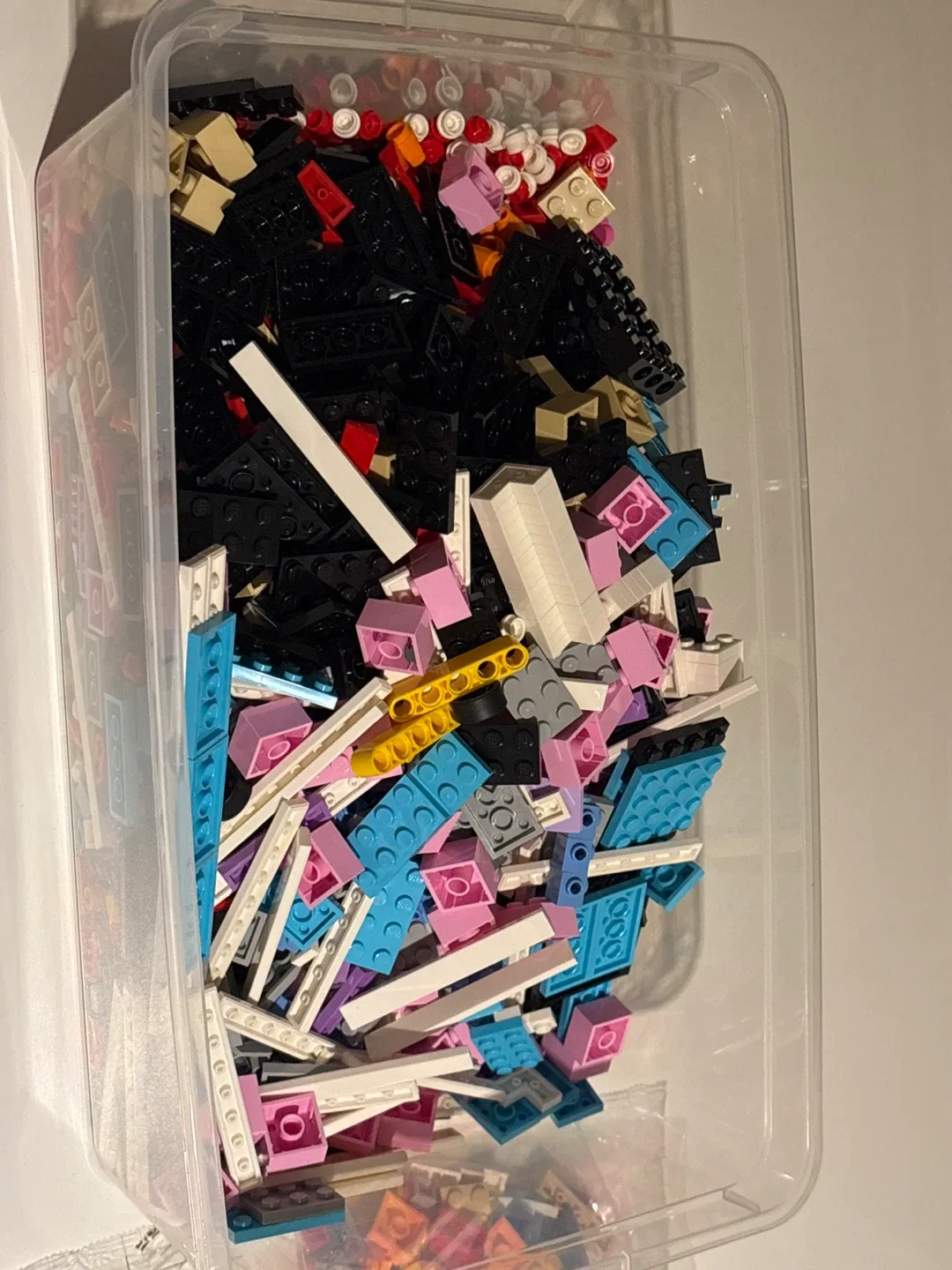 Mixed LEGO Pieces in Container
