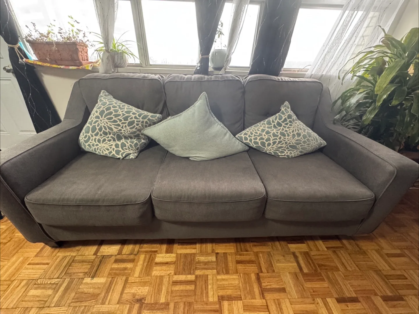 Comfortable Grey Three-Seater Sofa with pillows image indicator(3)