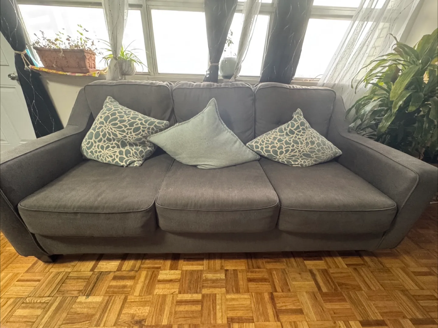 Comfortable Grey Three-Seater Sofa with pillows image indicator(4)