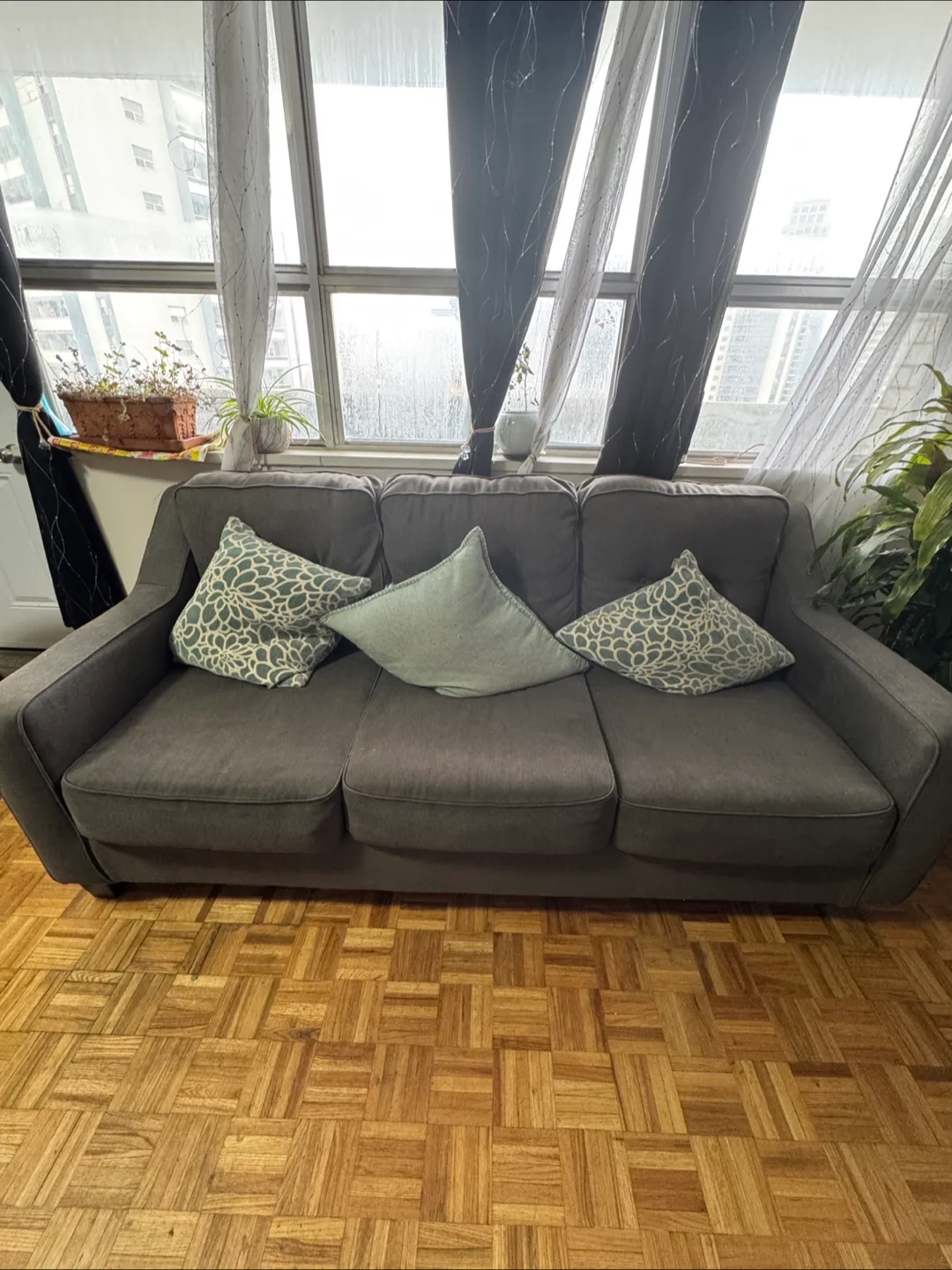 Comfortable Grey Three-Seater Sofa with pillows image indicator(2)
