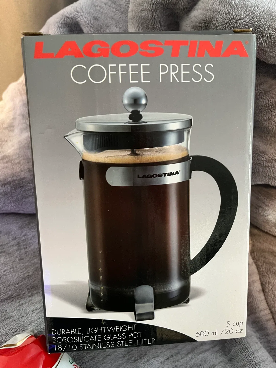 Coffee press with small bag of coffee