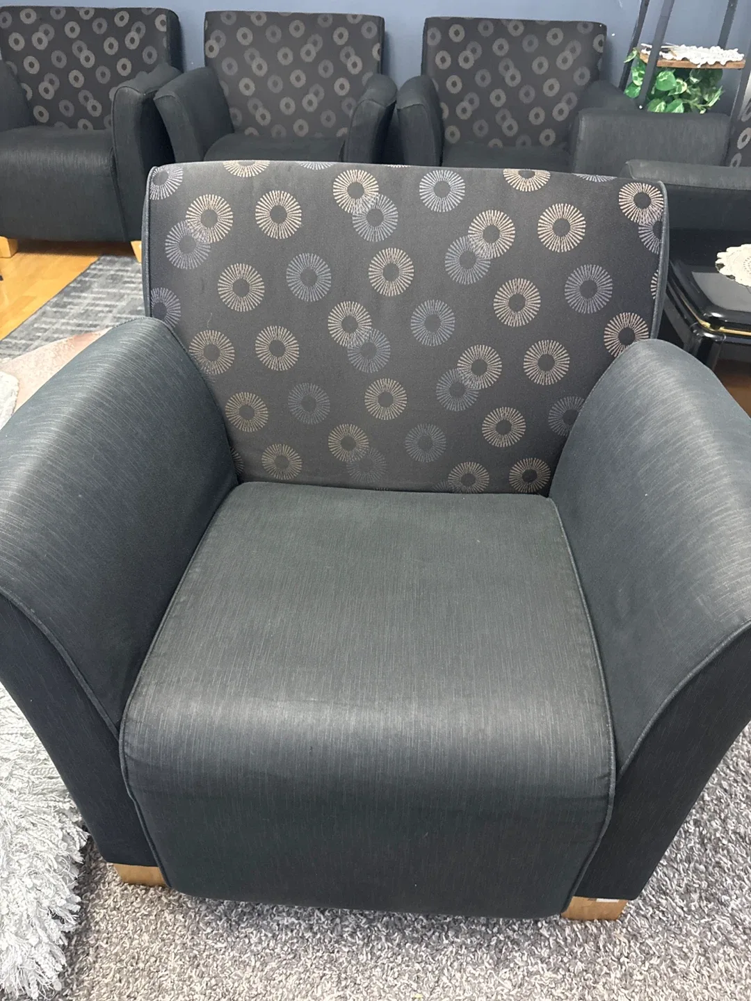 Black Armchair with attaching ones with Patterned Back