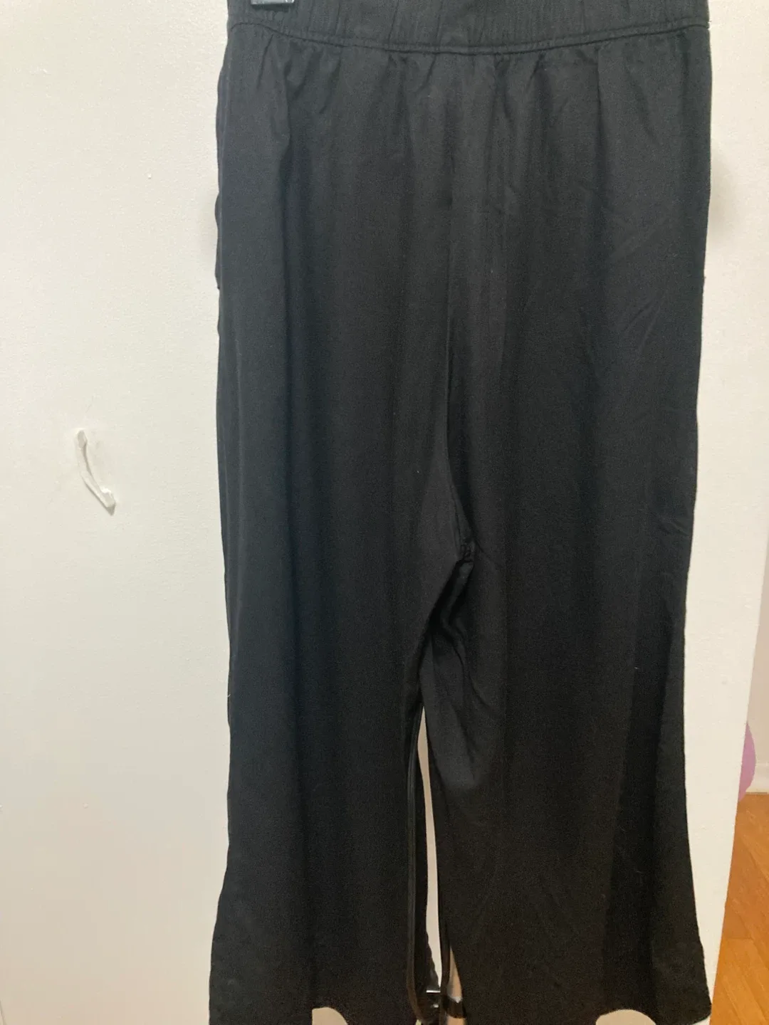 High waisted raised black wide leg trousers