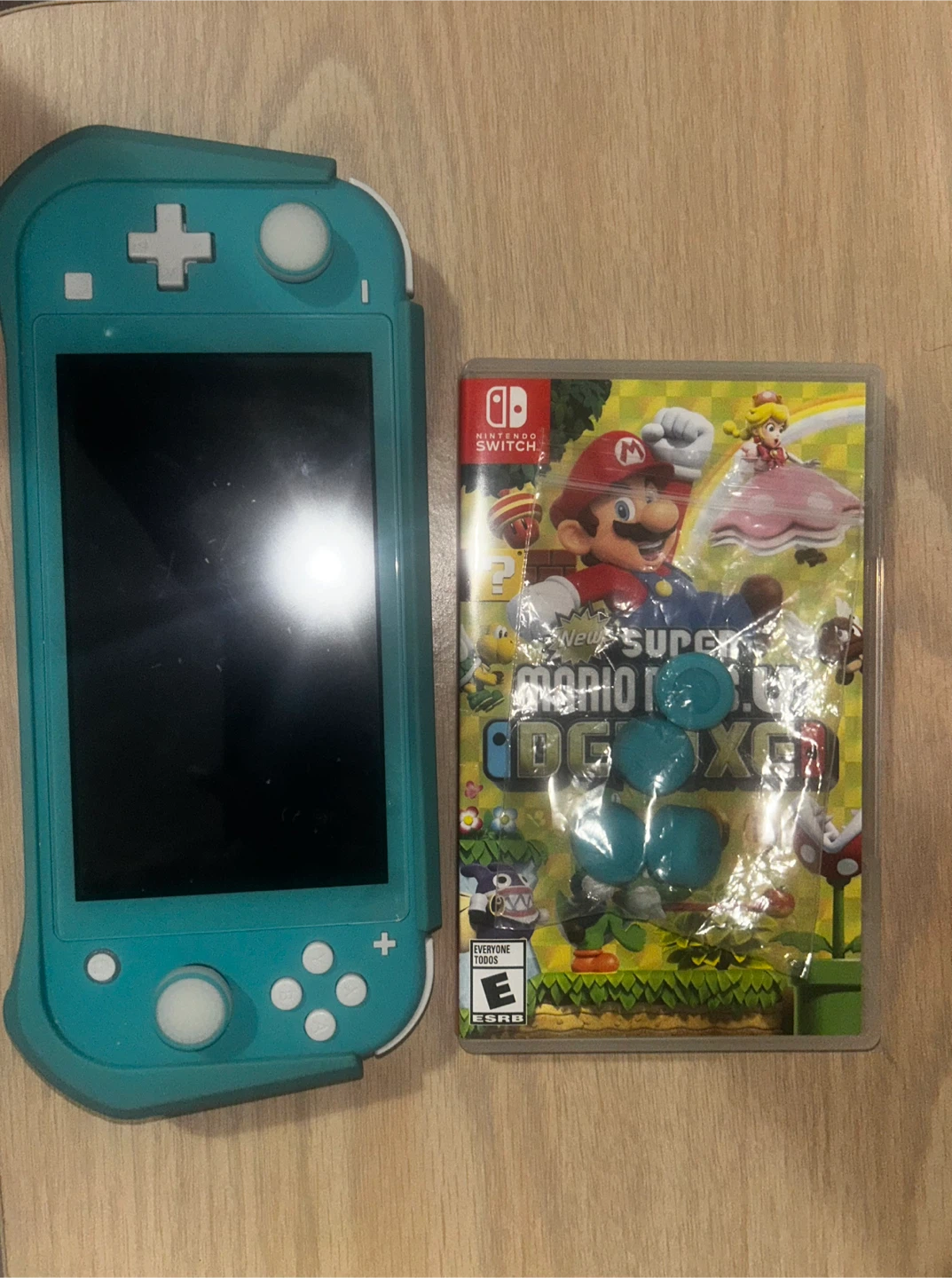 Nintendo Switch Lite Turquoise with Mario Deluxe Game