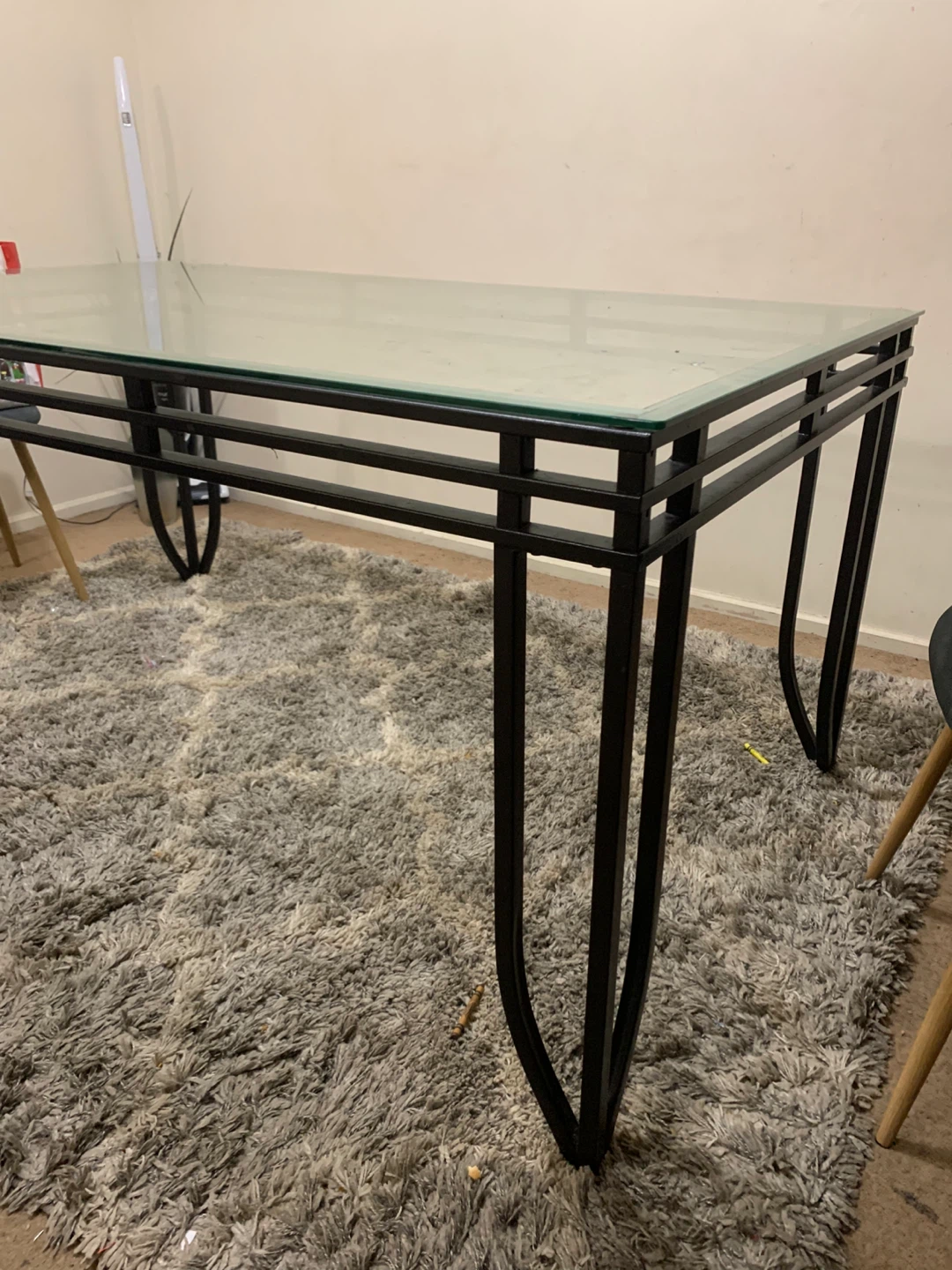 Glass top dining table with metal frame