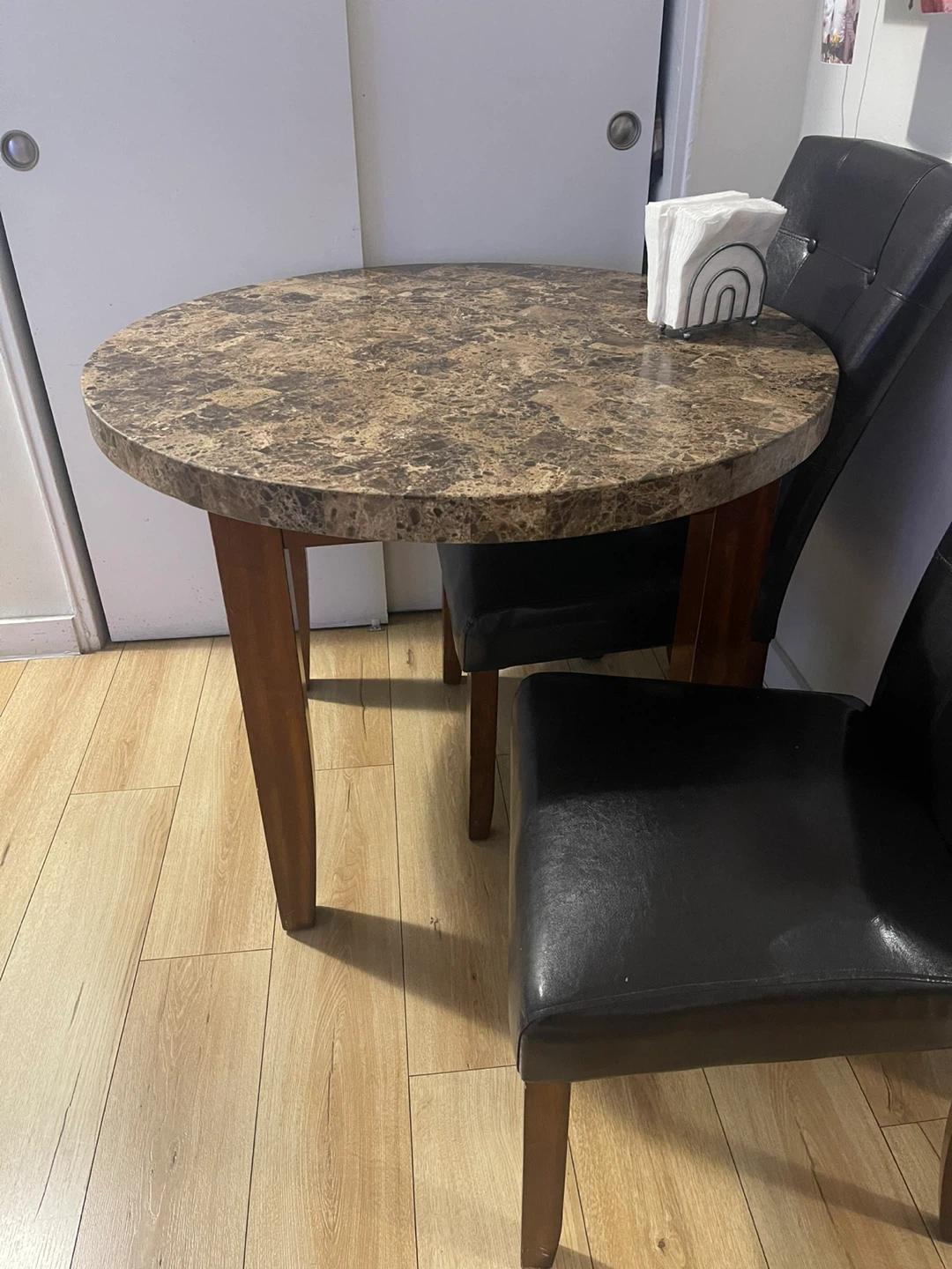 Round Marble Table with 2 Black Leather Chairs